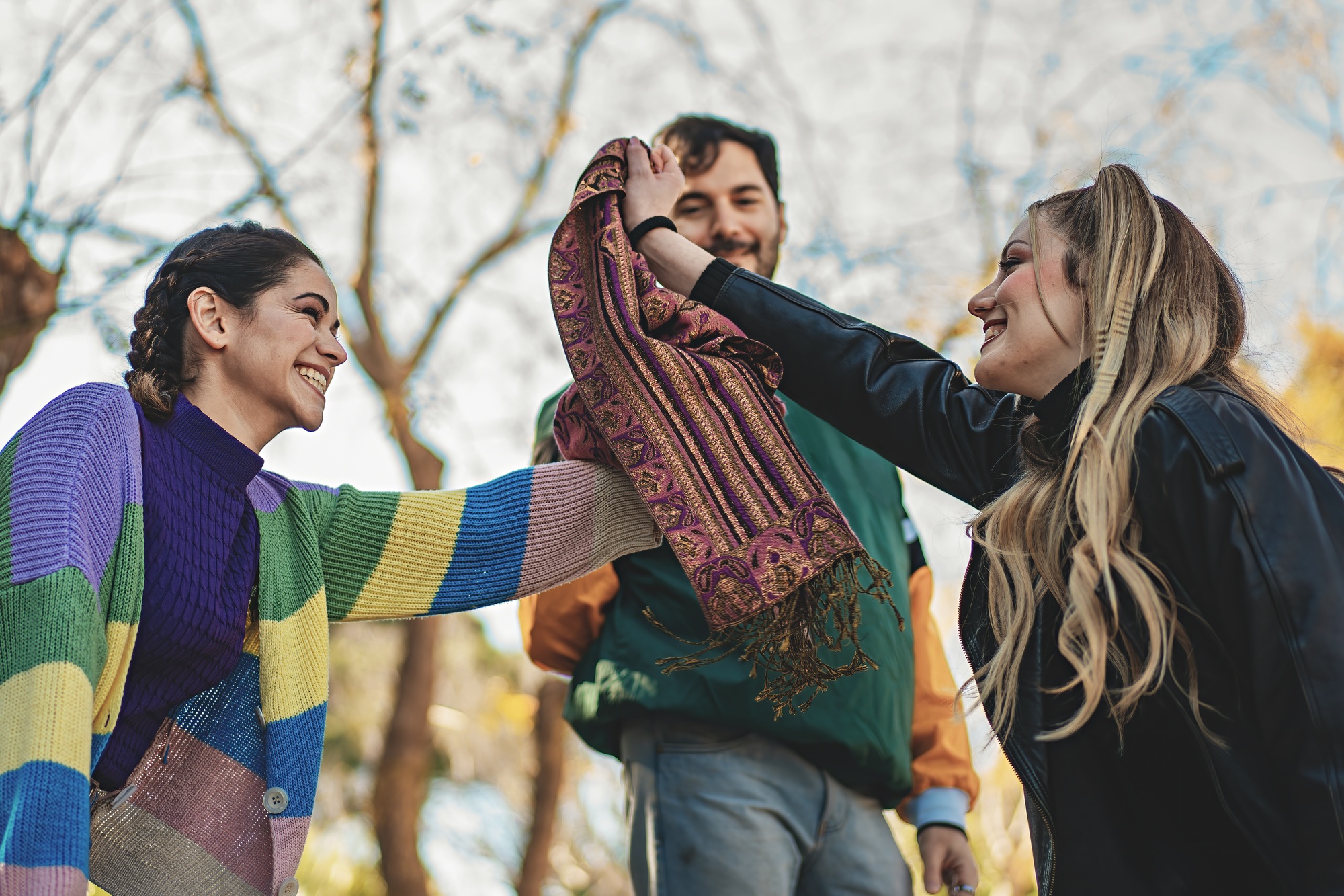 Group of young friends playing "Capture the Handkerchief" outdoors