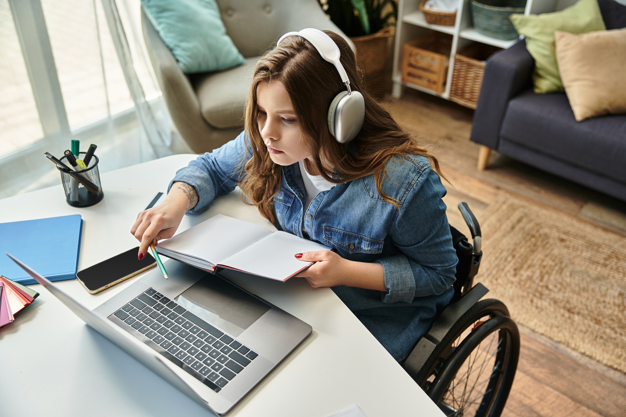 Young woman studying in modern apartment